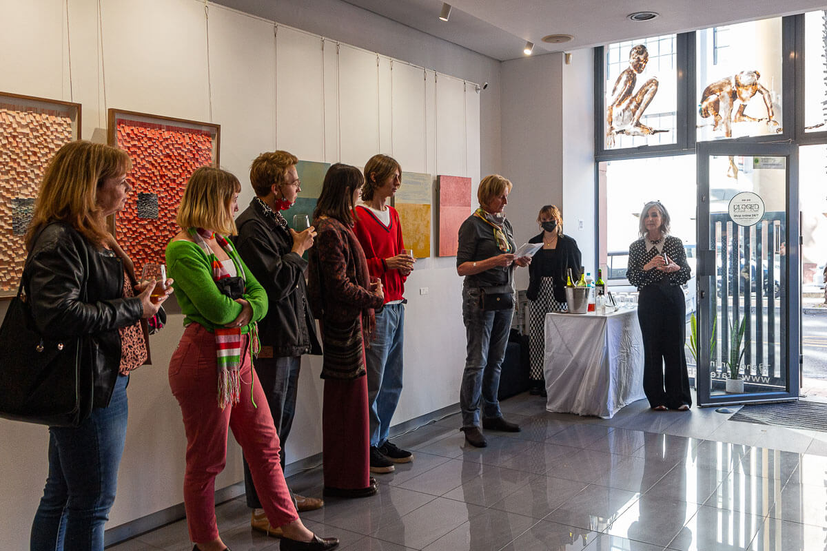 Tanja Truscott welcomes guests to the opening of Abstract*d